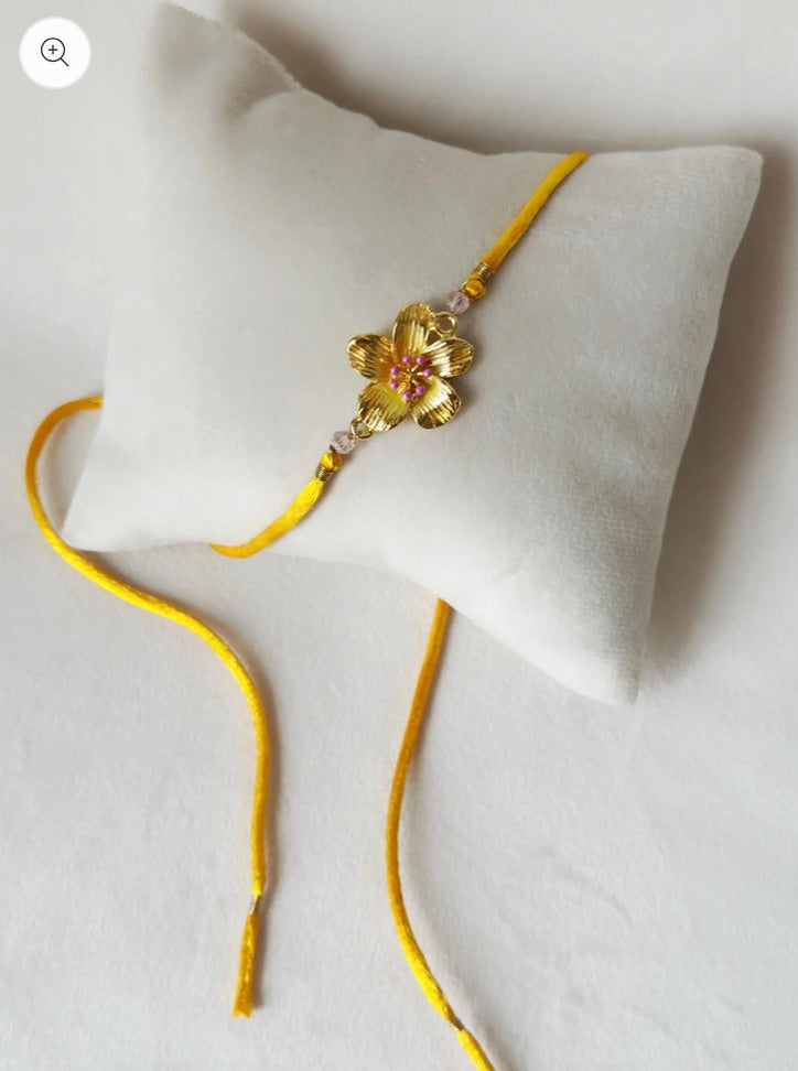 FLORAL RAKHI SMALL GOLD, PINK AND SAFFRON