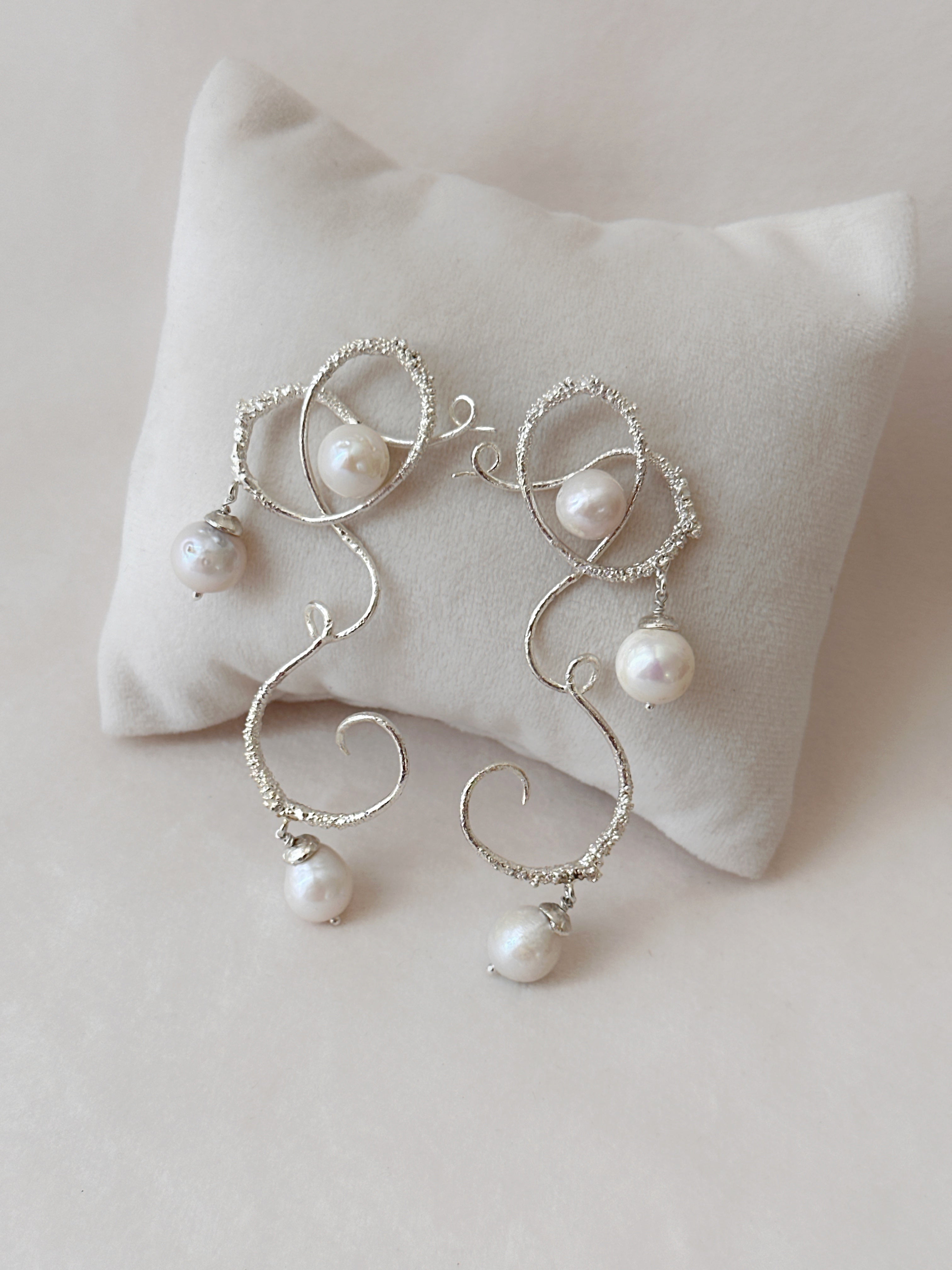 Curly worly pearly danglers Silver