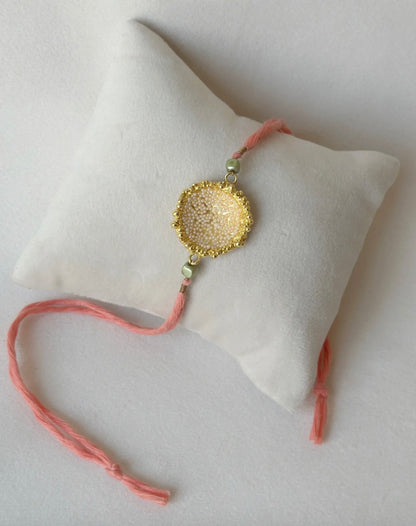 SURYA RAKHI GOLD AND PINK