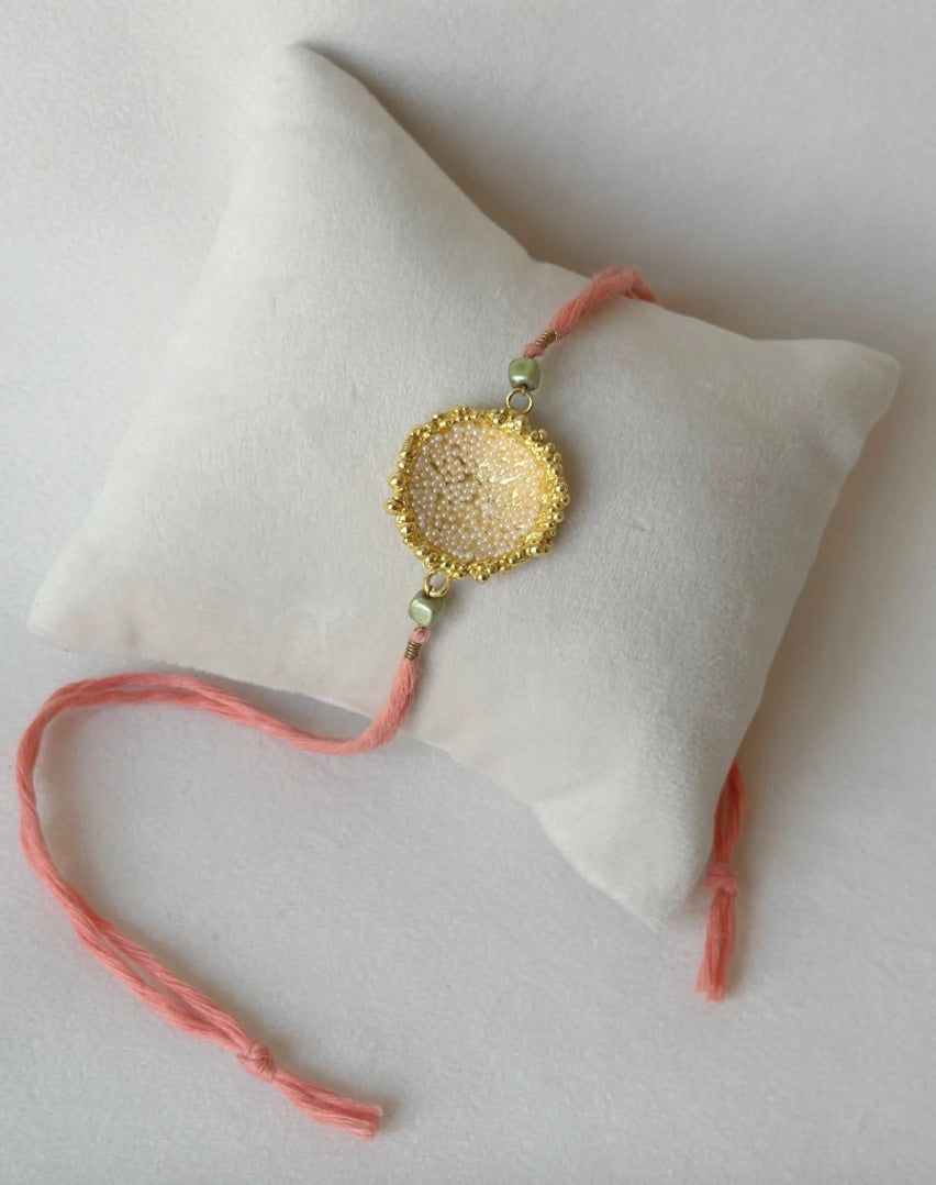 SURYA RAKHI GOLD AND PINK