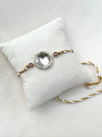 SURYA RAKHI SILVER AND WHITE GOLD