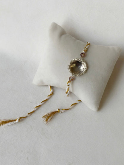 SURYA RAKHI SILVER AND WHITE GOLD