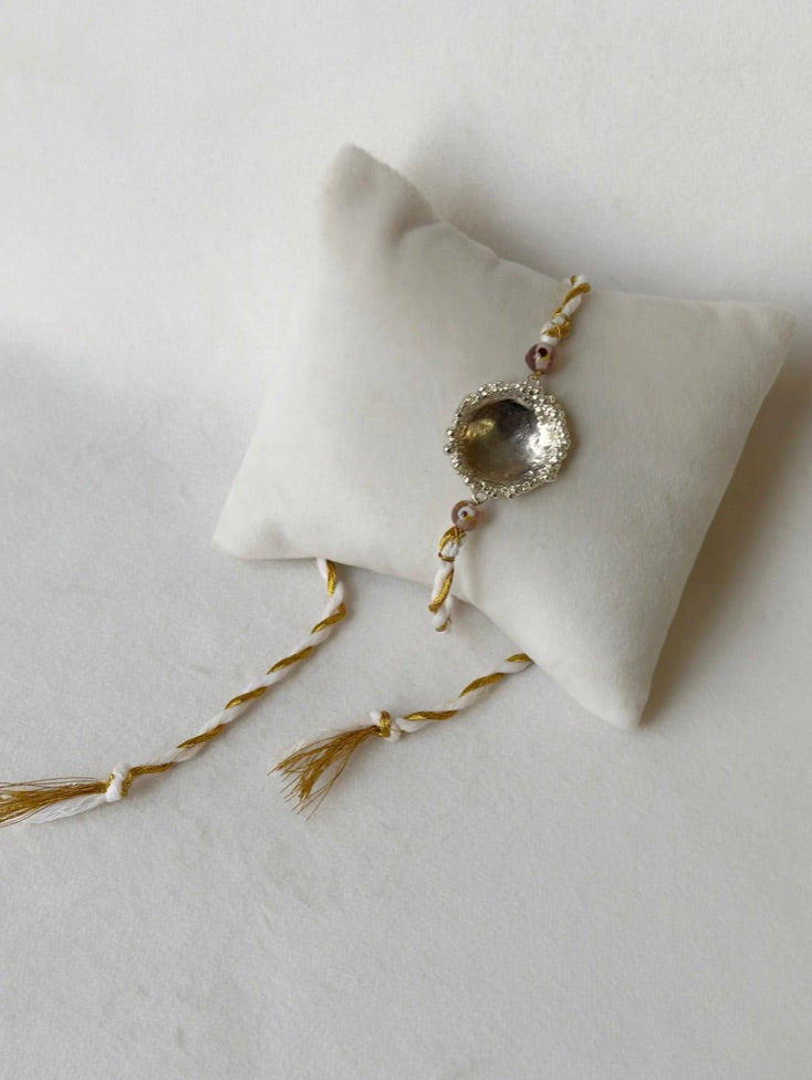 SURYA RAKHI SILVER AND WHITE GOLD