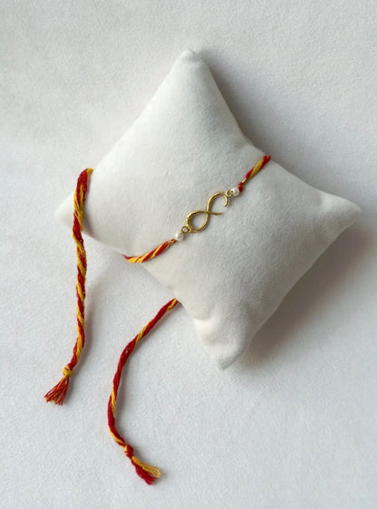 SMALL INFINITY RAKHI GOLD AND RED