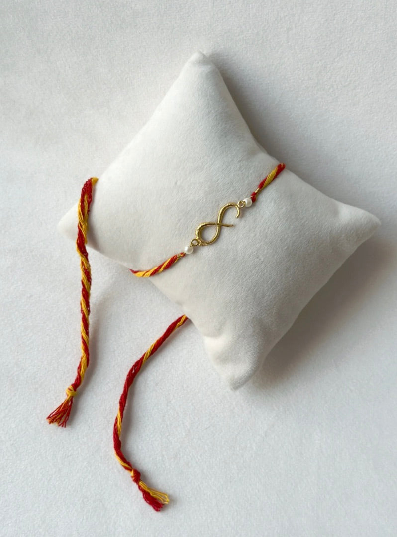 SMALL INFINITY RAKHI GOLD AND RED