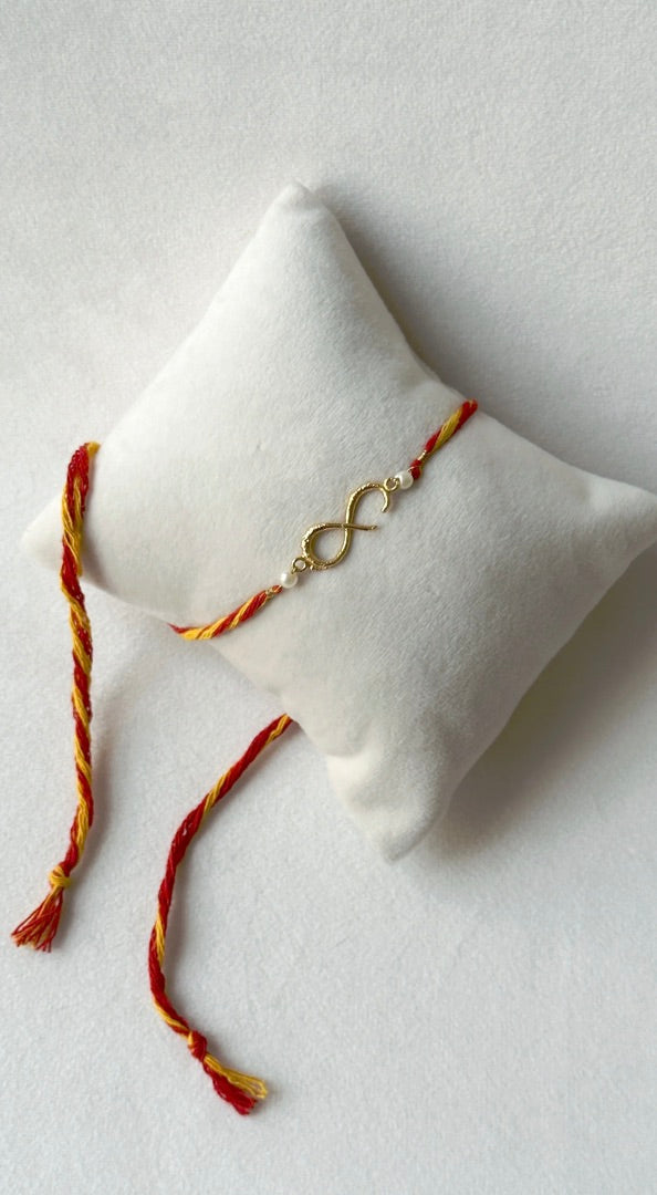 SMALL INFINITY RAKHI GOLD AND RED