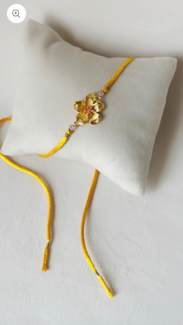 FLORAL RAKHI SMALL GOLD, PINK AND SAFFRON