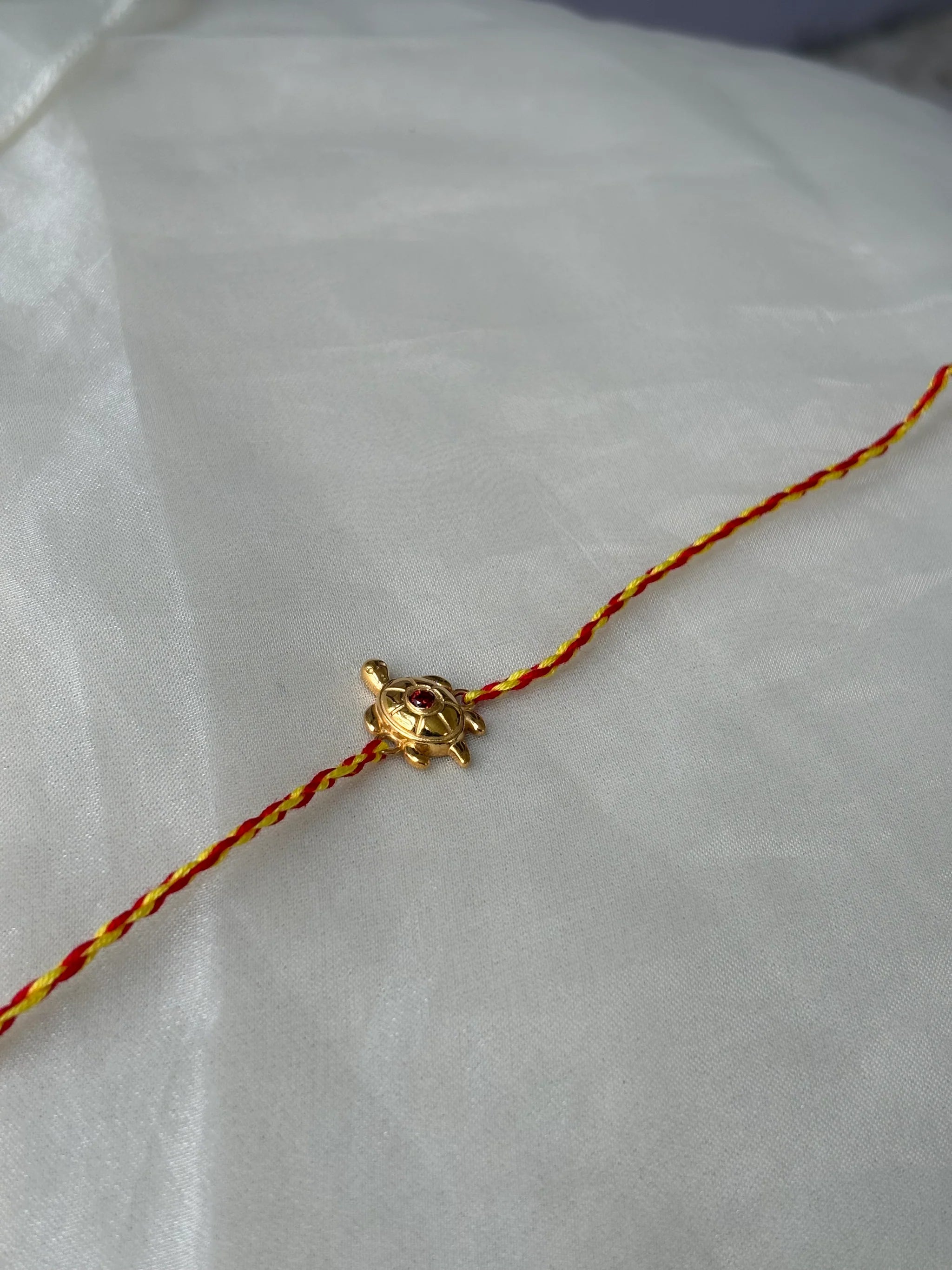 Turtle Rakhi Gold