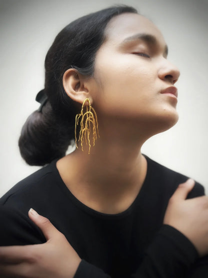 Untamed goddess dangles gold